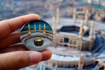 A person holding a promotional button with a building or landmark image on the back, ideal for event or location marketing use