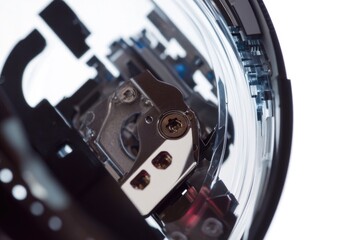 Poster - A close-up of a clock face showing the time and a key inserted into the clock mechanism
