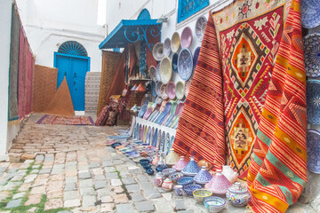 Souvenir earthenware and carpets in tunisian market, Sidi Bou Said, Tunisia, North Africa