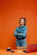 © Jacob Lund - Confident female creative in a minimalist orange office