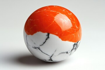 Poster - A bright orange and white marble ball sitting on a clean white surface, perfect for use in design or photography projects