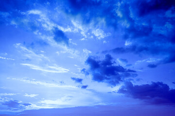 Wall Mural - blue tint cloudy sky at sunset. gradient color. sky texture. abstract natural background
