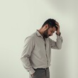 © Kunthana - Stressed Man  Tired Businessman  Sad Young Adult  Hand in Hair  Worried  Troubled  Pensive