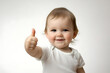 © svonidze - Happy baby giving a thumbs up