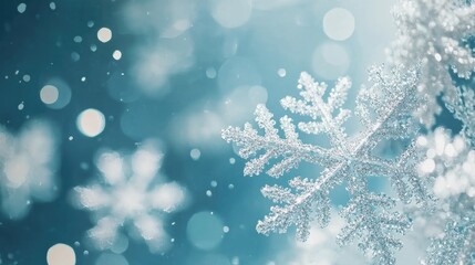 Poster - Macro shot of delicate Christmas snowflakes on a blue backdrop with blurred background creating a serene winter atmosphere.