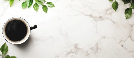 Aufkleber - Black coffee in a black cup on a white marble table surrounded by green leaves ideal for branding and text placement