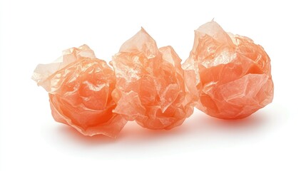 Aufkleber - Crumpled pink translucent paper balls isolated on a white background creating an artistic and abstract visual effect.