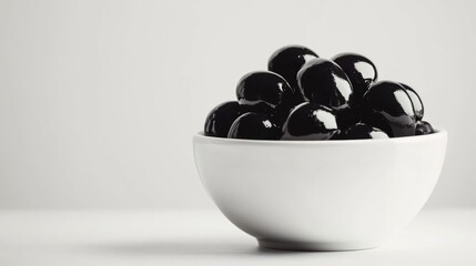 Poster - Glossy black olives arranged in a white bowl on a minimalistic background showcasing freshness and culinary appeal