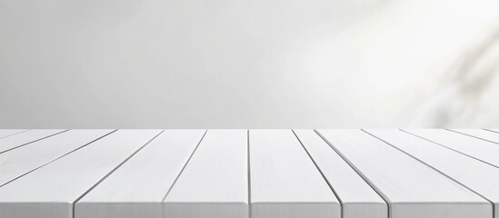 Poster - Minimalist white wooden desk in bright interior with ample empty space for text or product placement in modern design setting