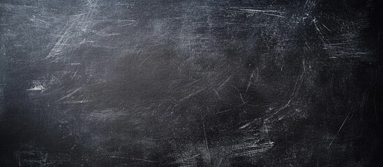 Poster - Chalkboard texture background in studio with ample copyspace ideal for text or graphic overlays suitable for educational or creative projects