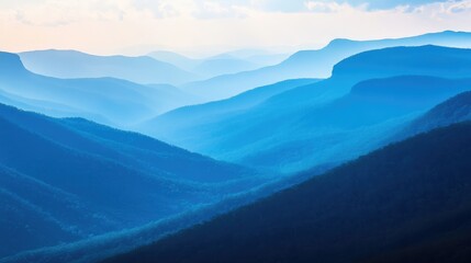 Poster - Serene blue mountain landscape with layered ridges and soft misty atmosphere ideal for nature and travel photography.