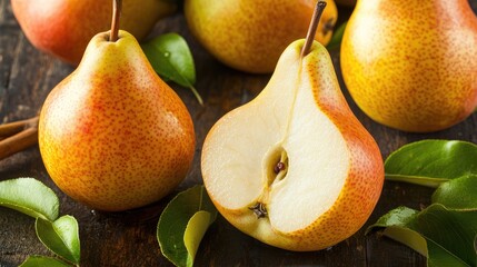Poster - Fresh ripe pears arranged on a rustic wooden surface with green leaves highlighting their natural beauty and vibrant colors in horizontal format
