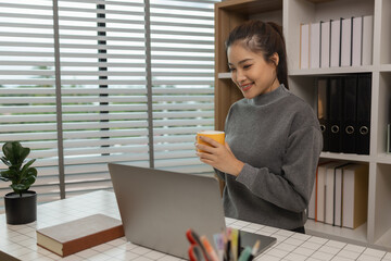 Sticker - happy woman working on laptop at home office, entrepreneur using laptop at home office, mature businesswoman working from home, beautiful company owner working during isolation period