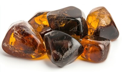 Poster - Polished amber stones display a range of warm hues and unique shapes on a clean white surface, highlighting their natural elegance