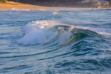 Wall Mural - Breaking wave on the ocean shore.