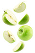 © Iurii Kachkovskyi - falling green apple with slices isolated on a white background