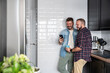 © ADDICTIVE STOCK - Loving gay couple enjoying quality time in modern kitchen