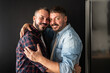 © ADDICTIVE STOCK - Loving embrace of a joyful gay couple celebrating togetherness