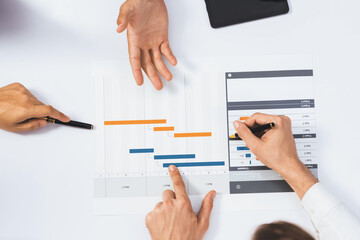 Leinwandbilder - Top view project manager communicate and collaborate with team using project management software, tracking progress of project task and making schedule plan at meeting table. Prudent