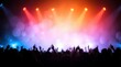 © robfolio - Excited Concert Crowd With Vibrant Stage Lighting And Colorful Bokeh