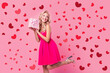 © deagreez - Photo of cute person arms hold giftbox look empty space wear mini dress high heels isolated on pink color background