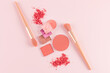 © ADDICTIVE STOCK - Flat lay of blushes and brushes on a soft pink background