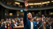 © Horizon Stock - Man Raises Hand in Public Gathering, Likely During a Meeting or Event