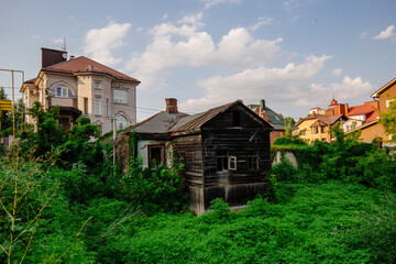 Wall Mural - Old overgrown abandoned wooden house