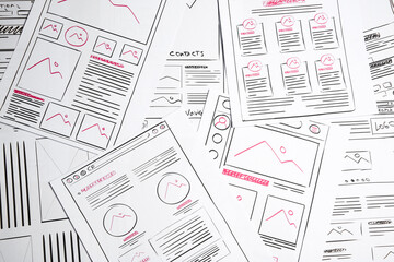 Leinwandbilder - Developing UI design. Sketches of website wireframes as background, top view