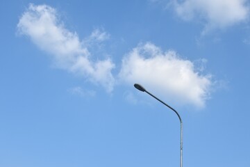 Wall Mural - electric lamp pole on cloud and sky background