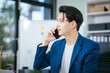 © NanSan - A male lawyer works diligently at his desk in a law office and courtroom, reviewing documents. He provides online legal consultations, assists businesses, and ensures justice through professional