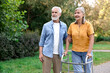 © New Africa - Senior couple with walking frame in park