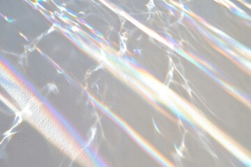 Poster - Glimmering light reflections create a stunning abstract texture on a smooth surface, showcasing vibrant colors and transparency.
