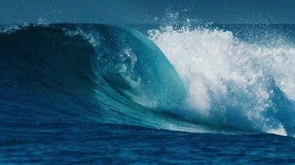 Wall Mural - Ocean wave rolls and breaks in the Maldives