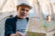 © BullRun - Cheerful senior man with map on street