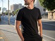 © MIkrom - Casual Man in Black T-Shirt on City Street