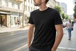© MIkrom - Casual Man in Black T-Shirt on City Street