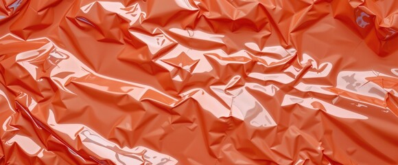 Poster - Abstract texture of crumpled orange plastic film Shiny reflective surface with folds and creases