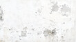 © Design House - White plaster with scuffs. Scuffed on a white wall. Old white plaster wall texture. White grunge wall background. White grunge concrete wall texture background.