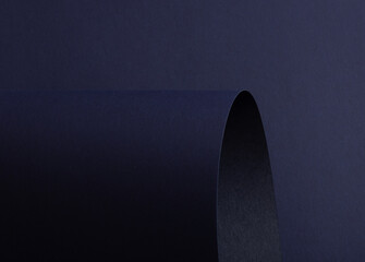 Poster - Midnight blue paper background with curved, matte surfaces and a smooth, grainy texture. Dark bold tones and a polished design create a dynamic, stylish, and refined composition.