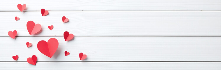 Poster - A Minimalist Design Features Small Red Paper Hearts Against A White Wooden Background, Ideal For A Postcard Or Love Message. 00001