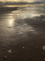 Wall Mural - North Sea coast and beach at Julianadorp Noord Holland Netherlands. Coastal area. Sunset at the shoreline.