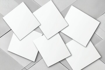 Poster - A collection of blank white square sheets arranged on a light gray background, ideal for use in graphic design, presentations, or as a canvas for creative projects.