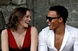 © Konstiantyn Zapylaie - Young caucasian female and african american male laughing together outdoors