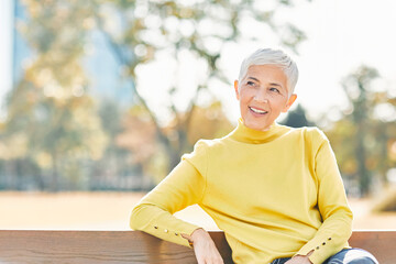 Wall Mural - woman outdoor senior happy retirement elderly portrait female active park smiling old fun nature happiness mature lifestyle beautifu