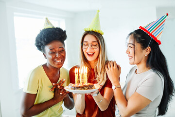 birthday celebration party cake happy candle blowing friendship fun friend woman home smiling lifest