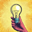 © RABBI - Hand Holding Glowing Light Bulb Idea Inspiration Retro Art