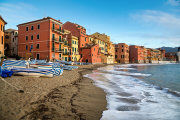 Wall Mural - A sand beach in the colorful Sestri Levante town on mediterranean coast of Ligury, Italy