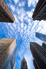 Poster - Upward View of Skyscrapers and Dynamic Cloud Formations in Bustling Cityscape : Generative AI