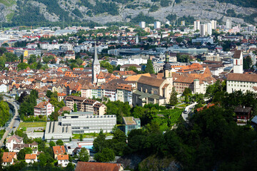 Wall Mural - Picturesque aerial view of Swiss town of Chur surrounded by mountains